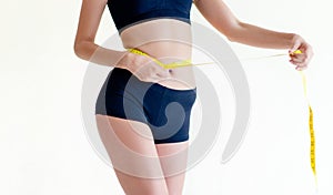 girl exercising Use the waist tape measure to check your waist circumference during daily exercise