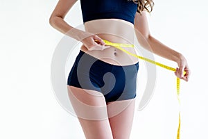 girl exercising Use the waist tape measure to check your waist circumference during daily exercise