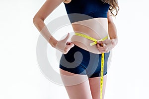 girl exercising Use the waist tape measure to check your waist circumference during daily exercise