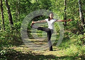 Girl exercising yoga - Parivrtta Hasta Padangusthasana