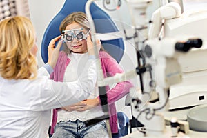 Girl at eye specialist controls vision