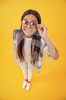 girl with eyesight glasses and checkered shirt. teenage girl wear eyesight glasses. teenage girl can see with eyesight