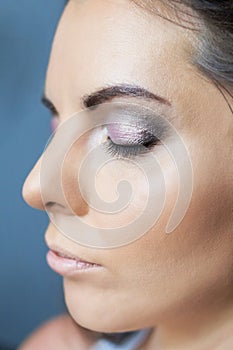 Girl face with makeup and eyes closed