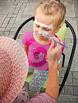 Girl with face painted