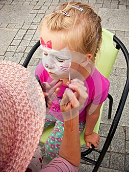 Girl with face painted