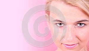 Girl face on a pink background photo