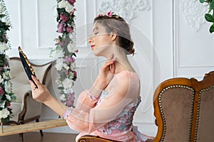 Girl in fairy costume with place for text. Light my mirror, tell me.