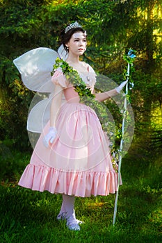 A girl in a fairy-tale image of a fairy queen.