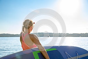 Girl family man woman are doing yoga on a sup