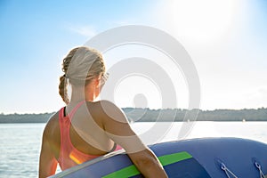 Girl family man woman are doing yoga on a sup