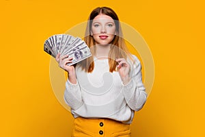 girl with fan dollars cash