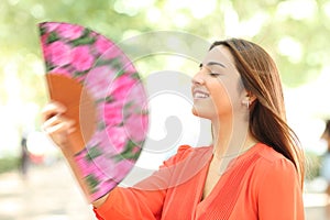 Girl fanning in a park photo
