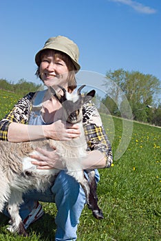 The Girl-farmer and young goat.