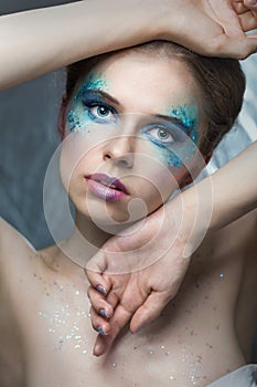 Girl with fashion make-up and sparkles