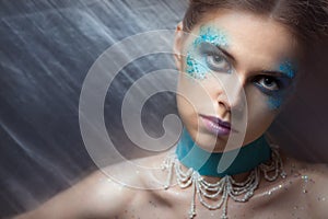 Girl with fashion make-up and sparkles