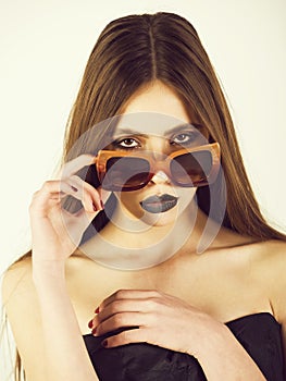 Girl or fashion model portrait, wearing stylish sunglasses