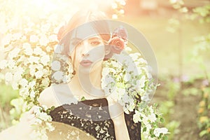 Girl with fashionable spanish makeup, rose flower in hair