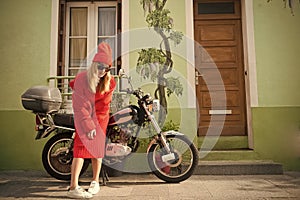 Girl in fashionable red dress, hat and glasses, france.