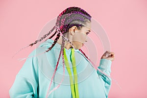 A girl with a fashionable set of multicolored braids Kanekalon. Colored artificial strands of hair