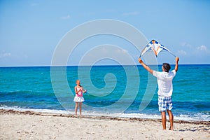Girl and father with kite