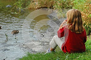 Girl feeding ducks