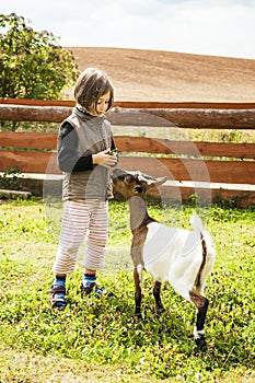 Girl Feeding goat