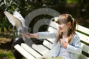 Girl Feeding Pigeon