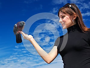 Girl feeds the dove