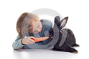 Girl feeds pet rabbit