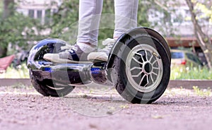 Girl feet on the hover board.