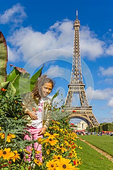 Girl on the field above Eiffel tower