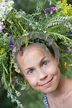 Girl in field flower garland