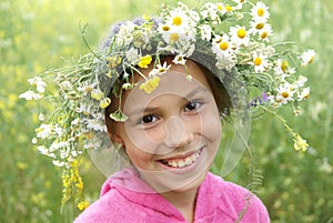Girl in field flower garland