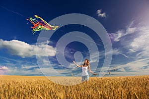 The girl in the field launches a kite