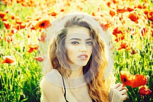 Girl in field of poppy seed