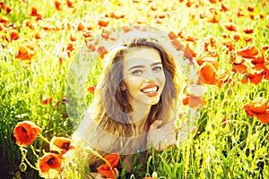 Girl in field of poppy seed