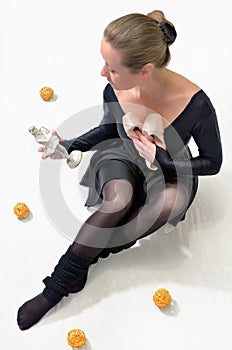 Girl with a figurine and pointe shoes