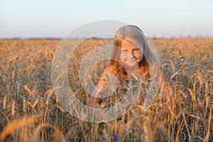 The girl in filed wheats.