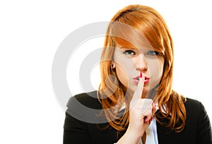 Girl with finger on lips hush hand gesture