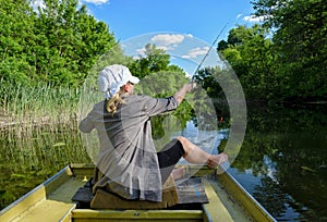 The girl fishing in the lake