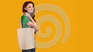 Girl With Flax Shopper Bag Posing Over Yellow Background, Panorama