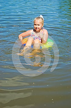 Girl floating in the river