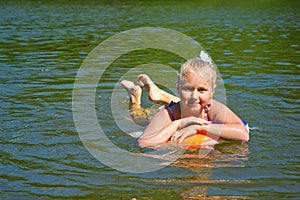 Girl floating in the river