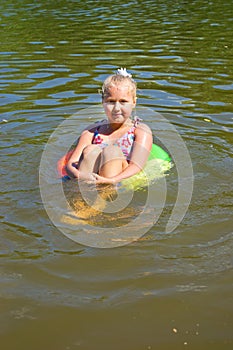 Girl floating in the river