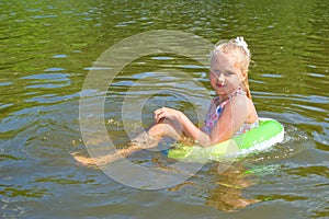 Girl floating in the river