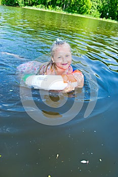 Girl floating in the river