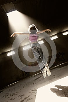 Girl floating up to bright light.