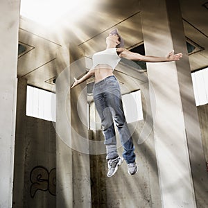 Girl floating up to bright light.