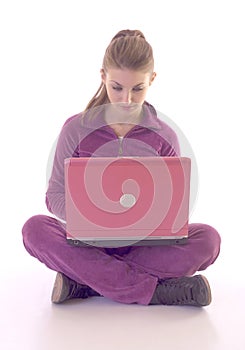 Girl on floor useing laptop