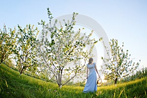 Girl in a flowering garden